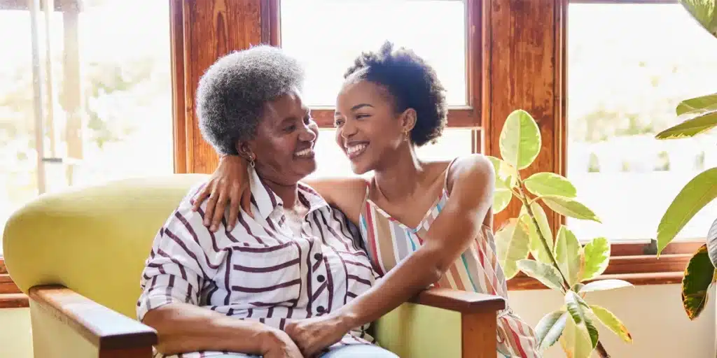 Daughter and mother hugging each other